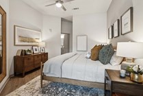 Relax in style with this beautifully designed bedroom, offering warmth and comfort.