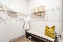 Enhance your lifestyle with this sophisticated walk-in closet design.