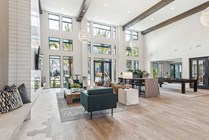 Experience luxury in this expansive, contemporary lounge with stylish furnishings.