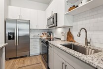 Experience culinary perfection in this stylish kitchen, equipped with premium features.