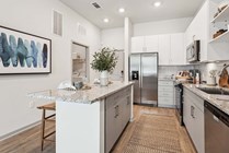 Explore this sleek kitchen, combining style with functionality.