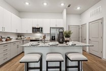 Experience the elegance of modern kitchen design with ample storage and style.