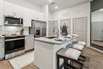 Experience the elegance of a modern kitchen designed for both style and functionality.