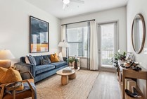 Step into this chic living space, where comfort meets contemporary style.