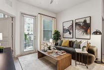 Experience modern elegance in this beautifully designed living room featuring chic furnishings and natural light.