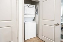 Experience effortless laundry days with this stylish and space-saving setup.